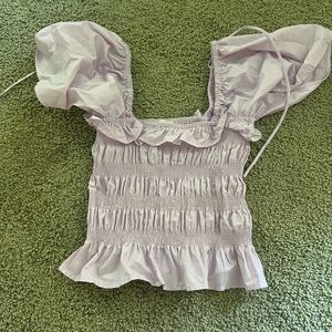 lavender top from a local boutique with ruffles and puffy sleeves